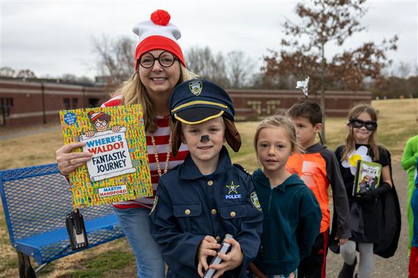 group of students with teacher in costumes